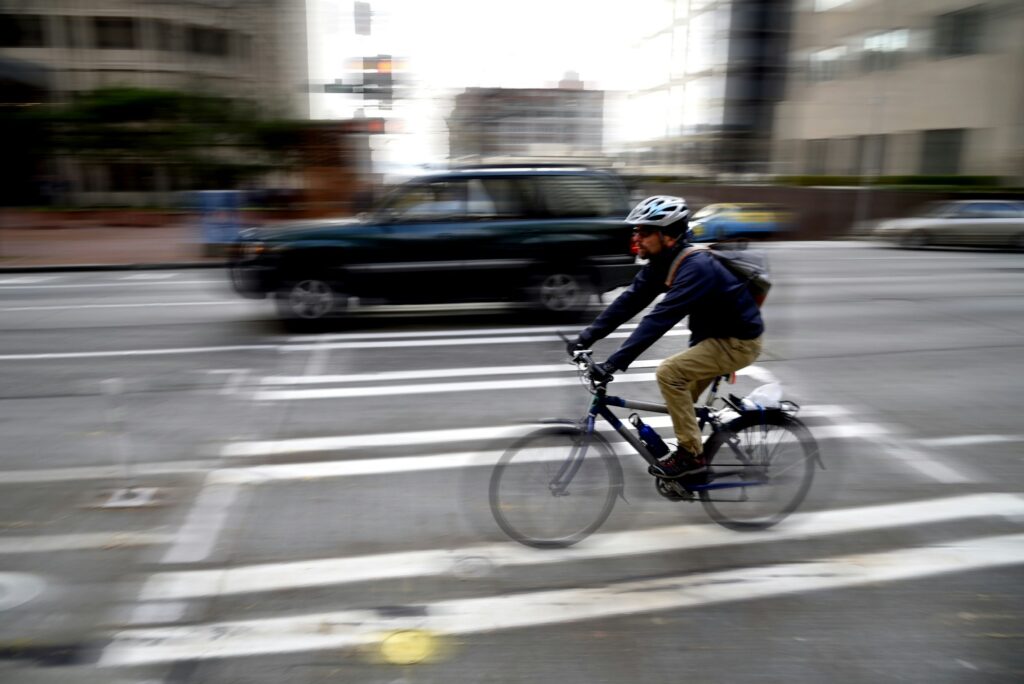 Commuter writing very quickly with motion blur in traffic